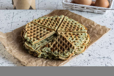 Home made waffles with spinach, heart shaped. Delicious breakfastの写真素材