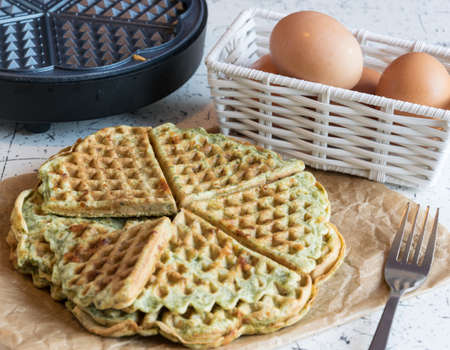 Home made waffles with spinach, heart shaped. Delicious breakfastの写真素材