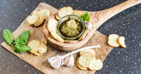 Crispy home-made basil bruschetta with basil pestoの写真素材