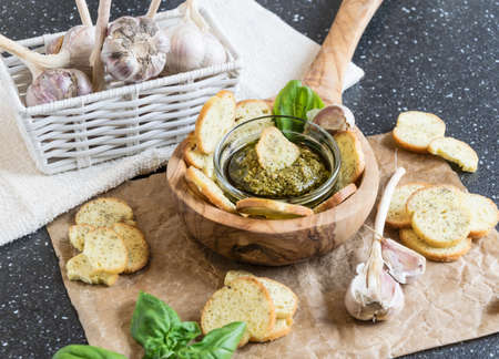 Crispy home-made basil bruschetta with basil pestoの写真素材