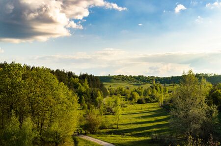 The view from the train window on the forest and hillsの写真素材