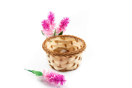 Beautiful small wicker basket with decorative flowers, beautiful composition boron harvestの写真素材