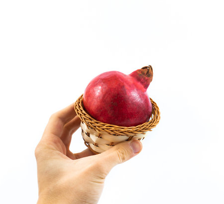 A series of photos with pomegranate on a white isolated background with empty space, beautiful...
