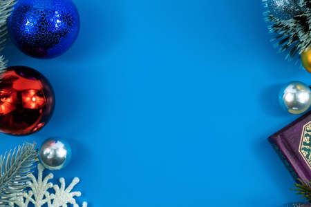 A small series of photos on a blue background on the theme of merry christmas and new year, decorations and cards with a place for wishesの写真素材