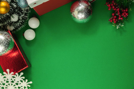 Christmas backgrounds with decorations on green, place for text and beautiful inscriptions, coziness...
