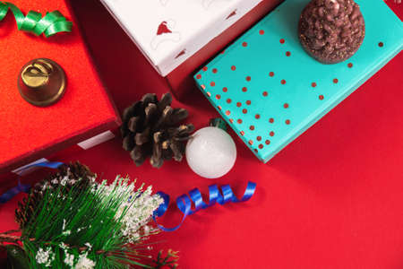 A series of very cozy New Year compositions and backgrounds on red, banners and wishes for a Happy New Year, decorations and gift boxes, postcardsの写真素材