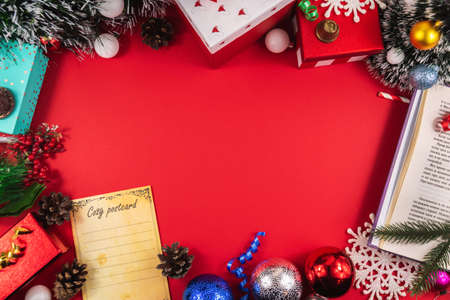 A series of very cozy New Year compositions and backgrounds on red, banners and wishes for a Happy New Year, decorations and gift boxes, postcardsの写真素材