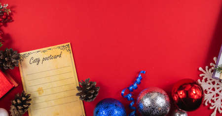 A series of very cozy New Year compositions and backgrounds on red, banners and wishes for a Happy New Year, decorations and gift boxes, postcardsの写真素材