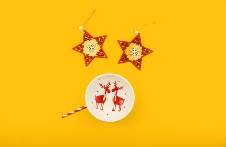 A series of beautiful conceptual photographs on a yellow and orange background for a christmas and...