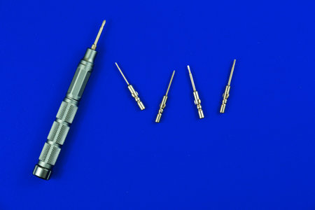 toy plastic plascomps, isolate on a blue background. Father day, construction industry, building and...