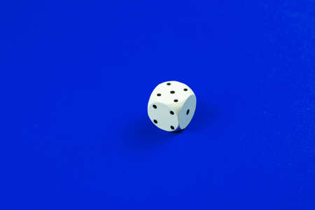 Dice macro photo on a plain monochrome backgroundの写真素材