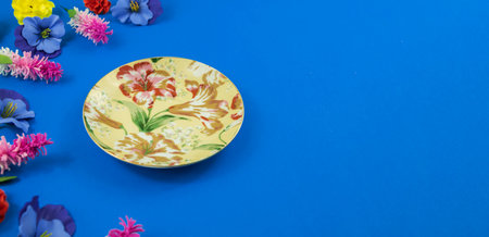 A series of photos on the theme of decorative flowers and backgrounds, flat design, patterns and top view, blue background, place for text, decorative service set, framesの写真素材