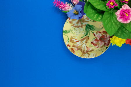 A series of photos on the theme of decorative flowers and backgrounds, flat design, patterns and top view, blue background, place for text, decorative service set, framesの写真素材