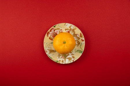 A series of pre-christmas photos on a red and yellow background with lollipops and attributes of the holiday, top view, flat designの写真素材