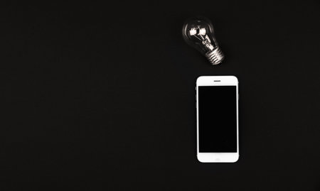 turn on tungsten light bulb, Realistic photo image Glowing yellow light bulb isolated on white backgroundの写真素材