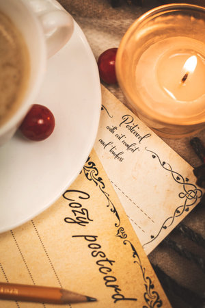 Romantic letter, greetings postcard with pencil, evening by candlelight and plaids, warm and cozy...
