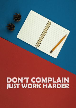 Motivational poster, don't complicate, just work harder, desktop and workplace with notepad and pen, simple and flat creative background, copy space, top view photoの写真素材