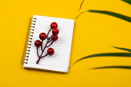 Workplace with a beautiful notepad and a houseplant, concept and composition of a desktop photoの写真素材