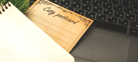 Winter flat lat composition banner for bloggers, concept of cozy holiday, postcard and laptop on...