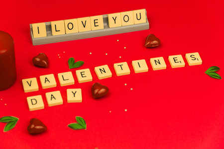 Words I love you, concept on cubes, red background and decoration, Valentine's day theme 2021 photo
