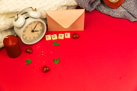 Be my greeting card, theme of love, february Valentine's day with decoration, love word on cubes, copy space and knintted sweaters photoの写真素材