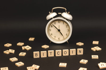 Creative photo of bitcoin crypto currency with alarm clock, time is money concept, new reality of...