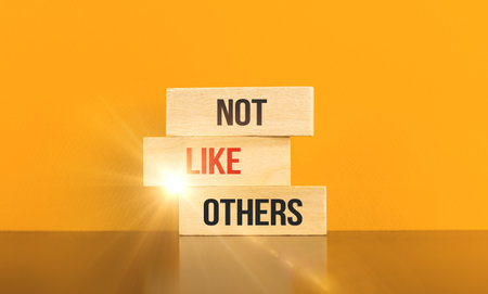 Freelancer and startup conceptual inspiration business image, banner with wooden blocks and text inscription not like othersの写真素材