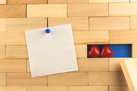 Happy valentine's day mockup and template image with pinned black notepad paper, two hearts, couple of lovers at house concept photoの写真素材