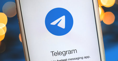 Kharkov, Ukraine - 26 January, 2021: banner of social media netwok Telegram icon on Apple iPhone with bokeh, photo for news and bloggersのeditorial素材
