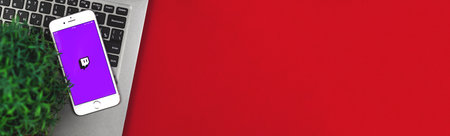 Kharkov, Ukraine - 26 January, 2021: twith , application on Apple iphone smartphone, icon, flat lay banner, copy space, workplace photoのeditorial素材