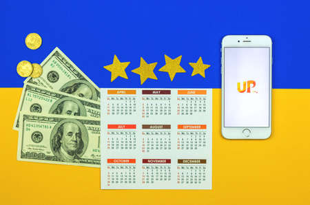 Kharkov, Ukraine - February 5, 2021: Skyup application on Apple smrtaphone, aircraft company service for air transportation, creative flat lay background and mockupのeditorial素材