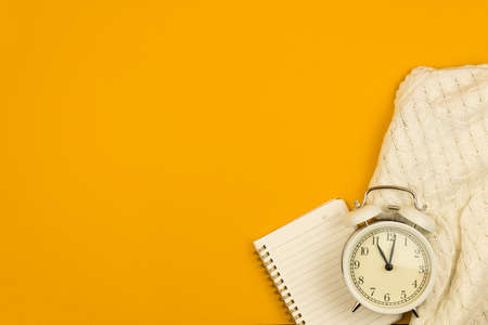 Flat lay yellow workplace or workspace table or desk with notepad, copy space composition, design for website's photoの写真素材