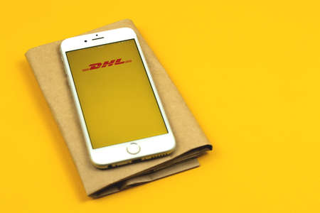 Kharkov, Ukraine - February 22, 2021: DHL paket app on screen of Apple smartphone, tracking your parcel conceptのeditorial素材