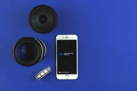 Kharkov, Ukraine - February 22, 2021: mobile Adobe Lightroom application, launch screen on Apple smartphone, creative background, copy space photoのeditorial素材