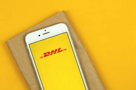 Kharkov, Ukraine - February 22, 2021: DHL paket app on screen of Apple smartphone, tracking your parcel conceptのeditorial素材
