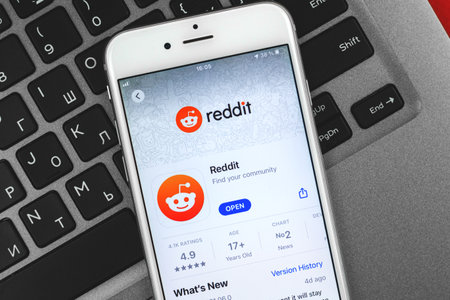 Kharkov, Ukraine - February 22, 2021: Reddit official application on screen of Apple smartphone, photoのeditorial素材