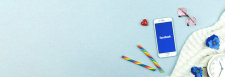 Kharkov, Ukraine - February 22, 2021: Facebook app banner, logo on Apple iPhone screen, copy space...