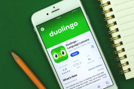 Kharkov, Ukraine - February 22, 2021: Duolingo app close up displayed on Apple smartphone, App store, creative background of language learning platform, photoのeditorial素材