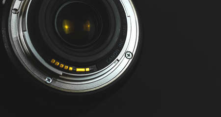 Kharkov, Ukraine - February 24, 2021: Canon camera lens mount macro and close up brand logo on black background photoのeditorial素材