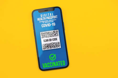 Smartphone with digital health passport application, modern concept, COVID-19, flat lay composition photoの写真素材