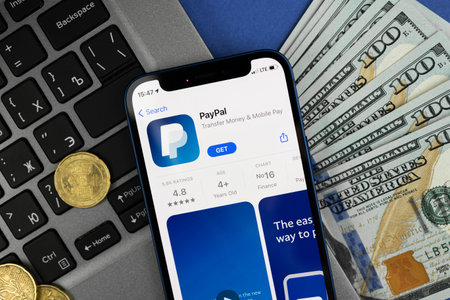 Kharkov, Ukraine - March 9, 2021: PayPal application on the screen, business background of online payment system, close-upのeditorial素材