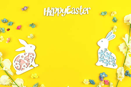 Happy Easter template with place for your text, easter bunny and eggs, top view and flat lay photoの写真素材