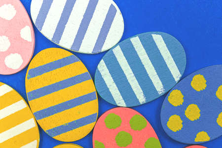 Colorful and flat painted easter eggs background close-upの写真素材