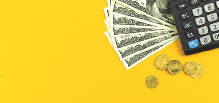 Financial background, calculator and money on office desk, banner concept, copy space photoの写真素材