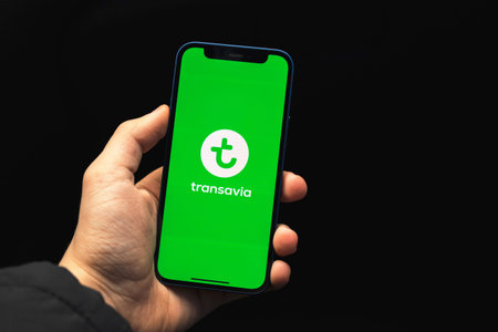 Kharkov, Ukraine - March 17, 2021: Transavia Airlines application, title screen displayed on smartphoneのeditorial素材
