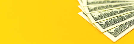 A pile of US dollar bills backgrond, banner of office desk with money, copy space photoの写真素材