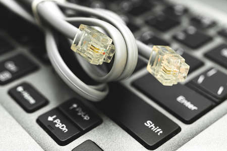 Background with Ethernet cable, lan internet wire data connection, networking and communication concept photoの写真素材