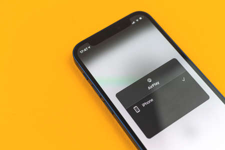 Kharkov, Ukraine - March 10, 2021: Airplay application and service by Apple, copy spaceのeditorial素材