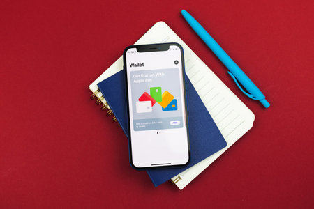 Kharkov, Ukraine - March 10, 2021: Mobile payment and digital wallet service by Apple Pay,...