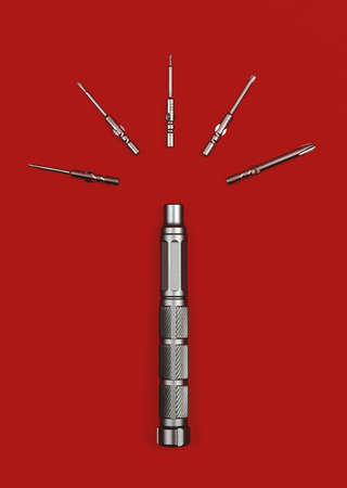 Screwdriver with bits on a red background, flat lay photo of equipmentsの写真素材